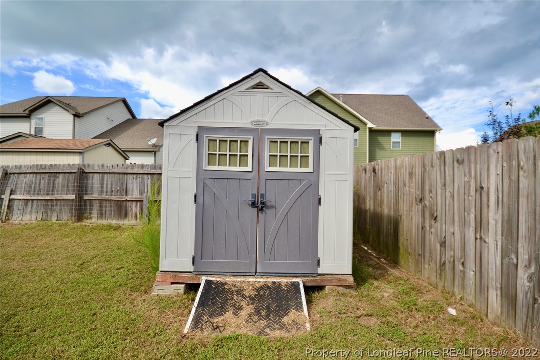 3608 Talus Road Fayetteville, NC 28306 - Photo 42 of 46 a front view of house with yard space and seating
