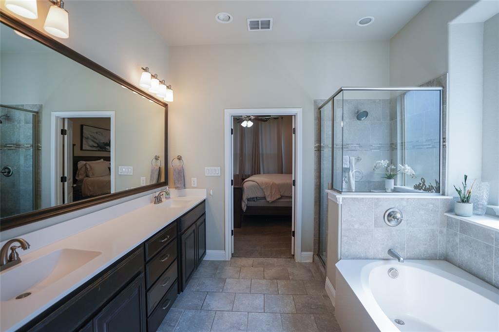 3009 Treasure View Drive Decatur, TX 76234 - Photo 13 of 26 Ensuite bathroom featuring a bath, double vanity, a stall shower, recessed lighting