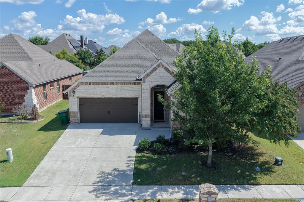 3009 Treasure View Drive Decatur, TX 76234 - Photo 4 of 26 French country inspired facade with stone siding, driveway, a front lawn, a garage, and brick siding