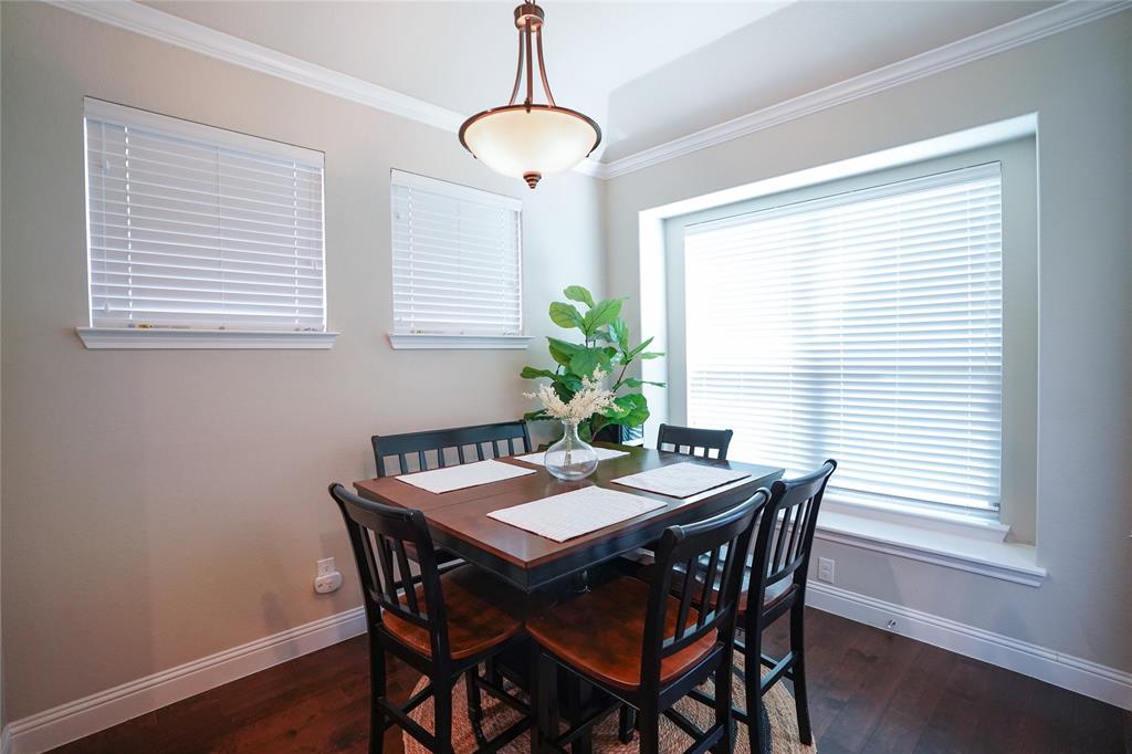 3009 Treasure View Drive Decatur, TX 76234 - Photo 9 of 26 Dining room with ornamental molding and dark wood finished floors