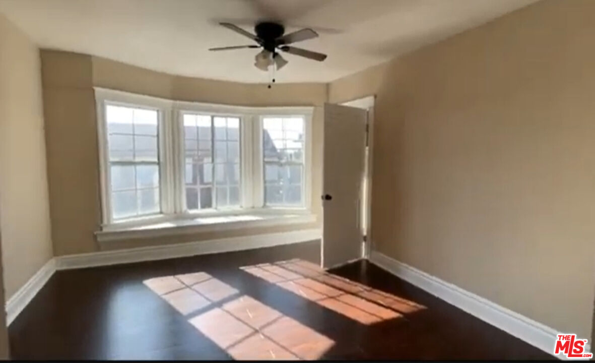 1284 West 38th Street Los Angeles, CA 90037 - Photo 4 of 14 a view of an empty room with a window
