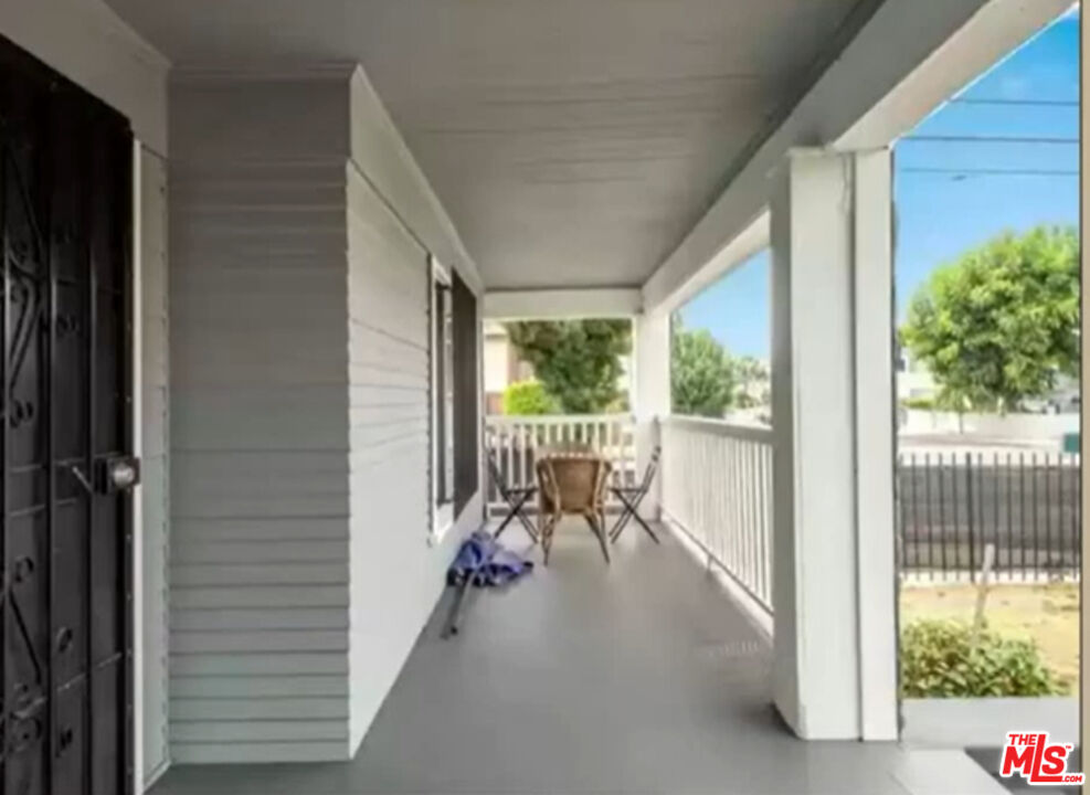 1284 West 38th Street Los Angeles, CA 90037 - Photo 7 of 14 a view of a hallway with wooden floor and windows