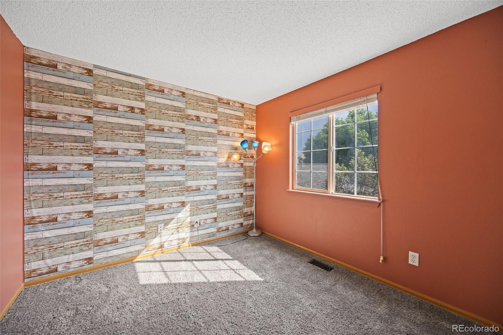 11100 Callaway Court Parker, CO 80138 - Photo 17 of 39 a view of an empty room with a window
