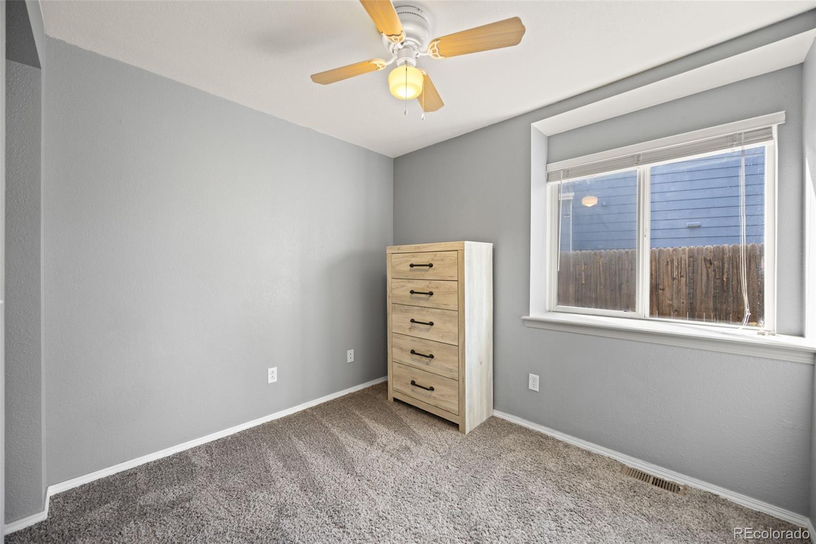 11100 Callaway Court Parker, CO 80138 - Photo 20 of 39 an empty room with windows and closet