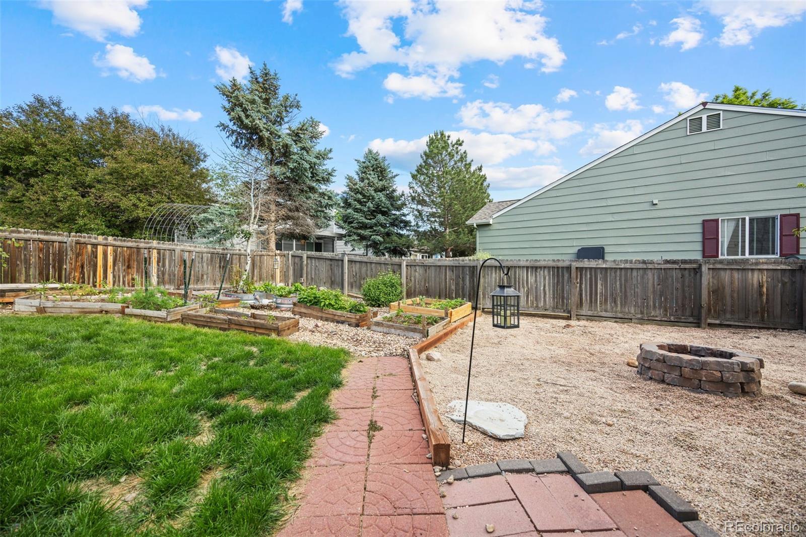 11100 Callaway Court Parker, CO 80138 - Photo 26 of 39 a view of a backyard with sitting area and furniture