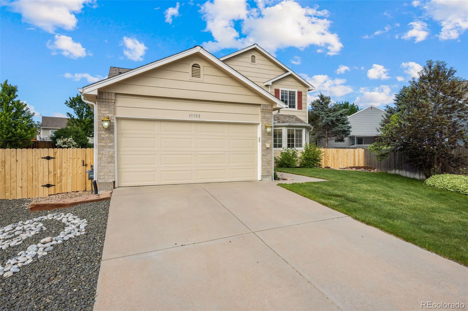 11100 Callaway Court Parker, CO 80138 - Photo 38 of 39 a view of a white house with a yard