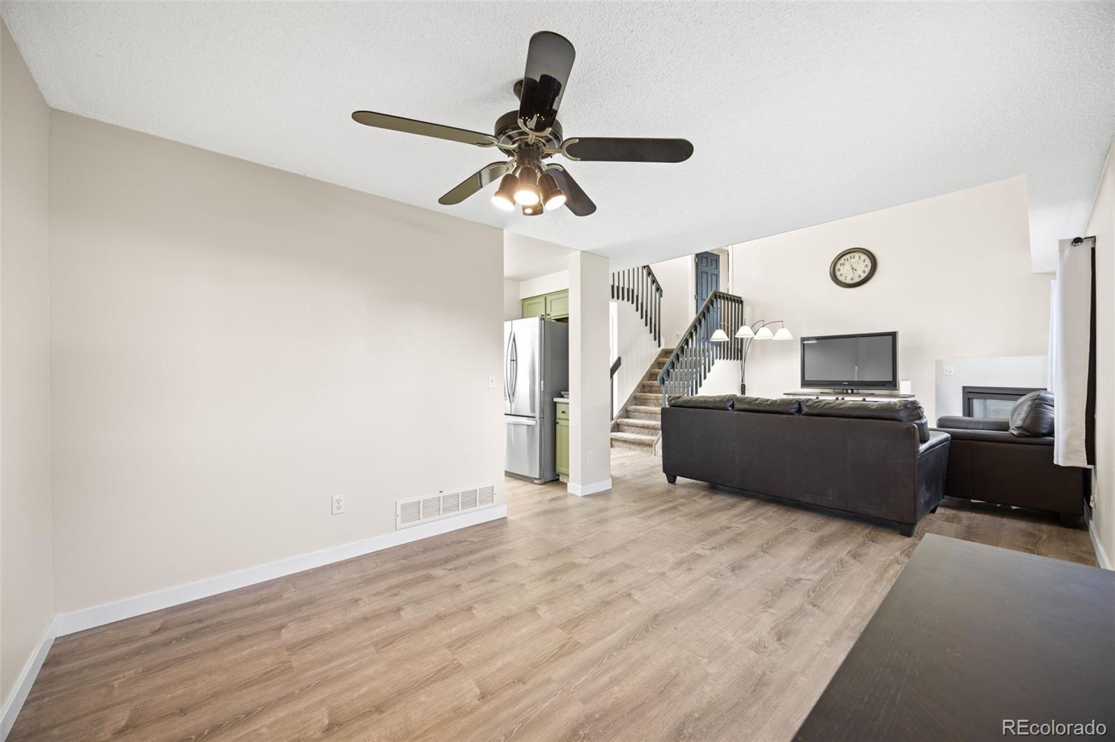 11100 Callaway Court Parker, CO 80138 - Photo 7 of 39 a view of a livingroom with a fireplace