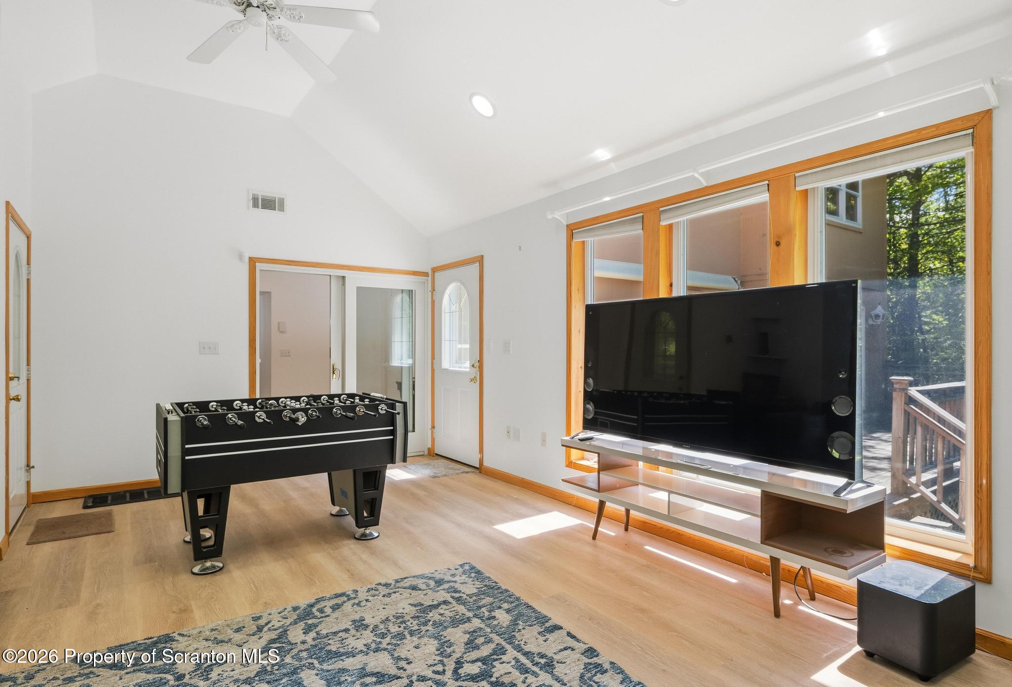58 Bender Road Gouldsboro, PA 18424 - Photo 18 of 55 a living room with a flat screen tv and piano table