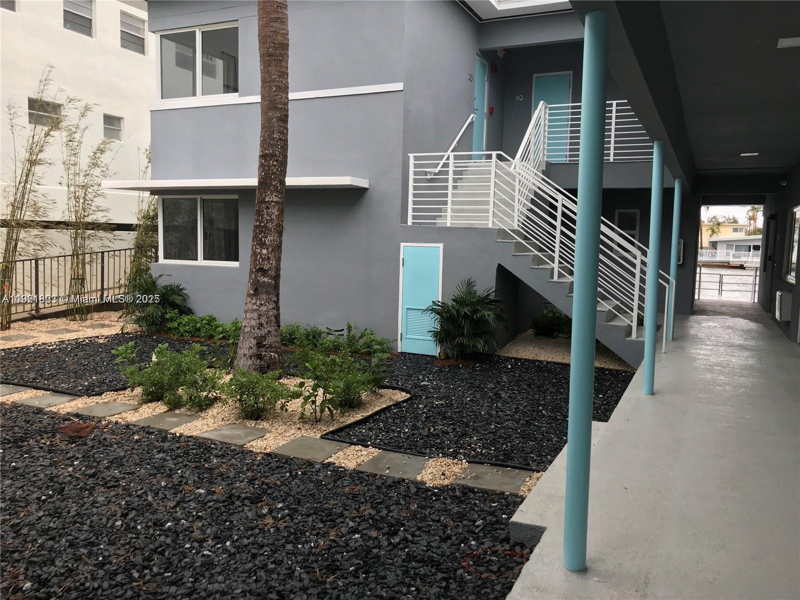 8260 Byron Avenue, Unit 13 Miami Beach, FL 33141 - Photo 3 of 5 a view of a house with a yard