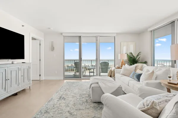 a living room with furniture and a large window