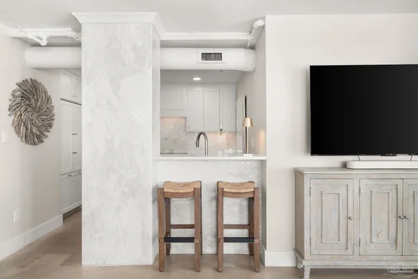 a kitchen with cabinets and window