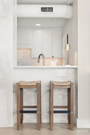 a kitchen with cabinets appliances and a sink