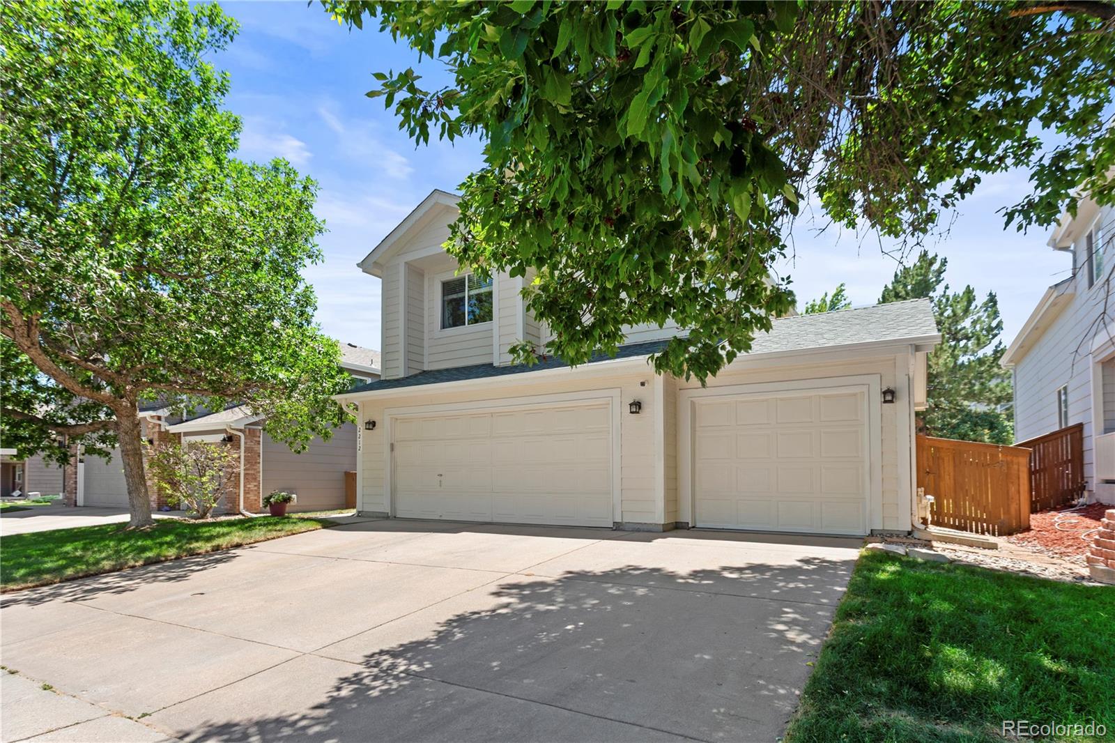 2212 Hyacinth Road Littleton, CO 80129 - Photo 2 of 44 front view of a house with a yard