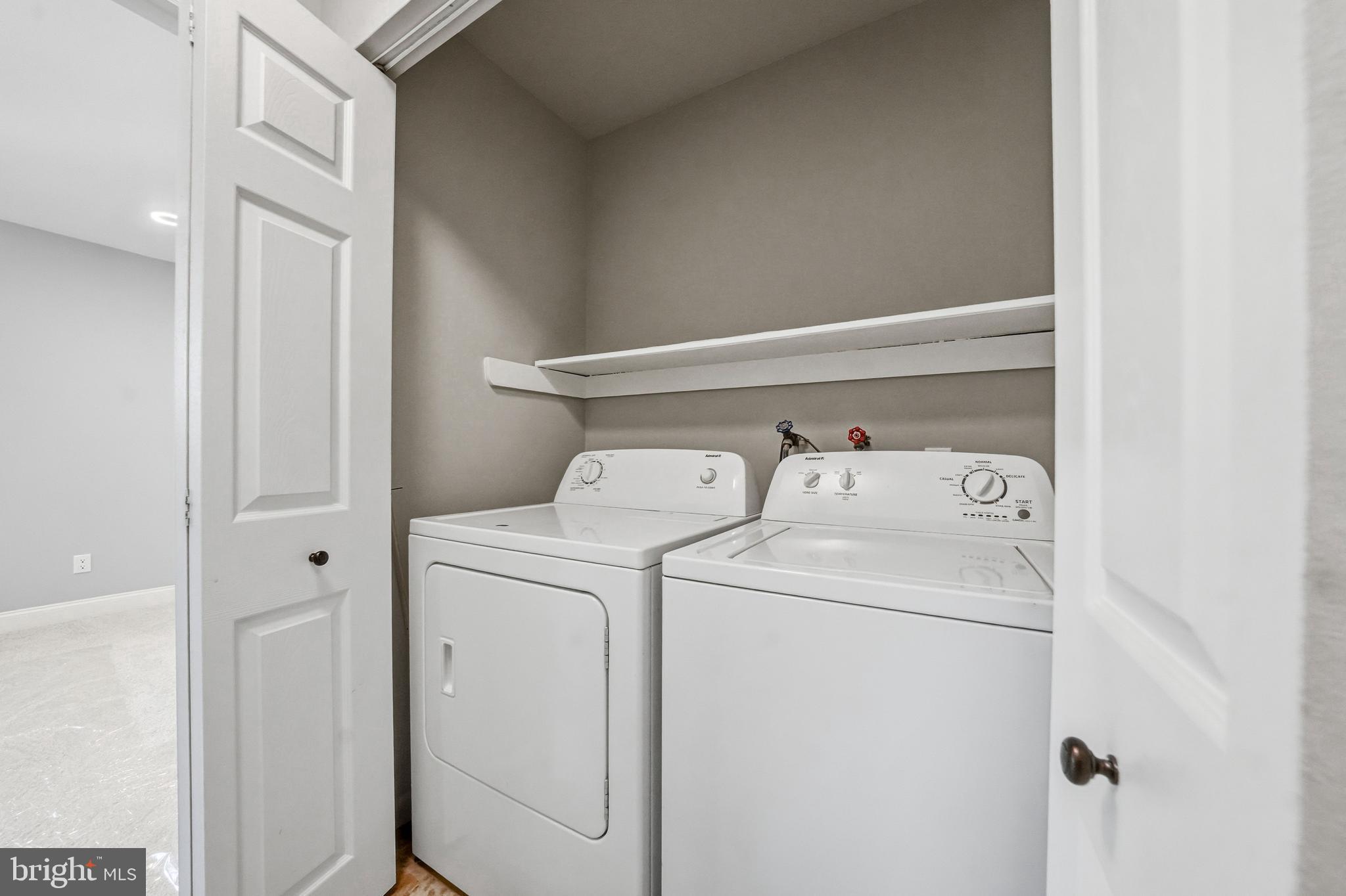 50 Centennial Road Telford, PA 18969 - Photo 16 of 21 Upstairs hall laundry with washer and dryer