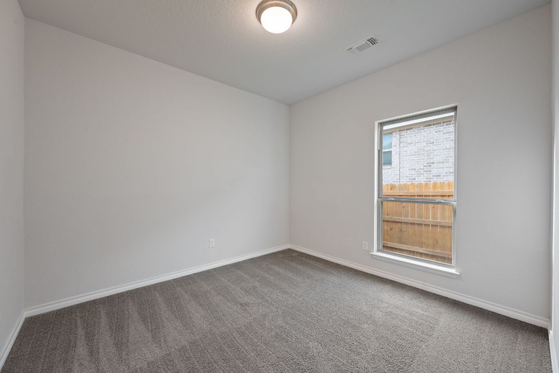 1037 Thunderhead Trail Georgetown, TX 78628 - Photo 21 of 33 an empty room with windows