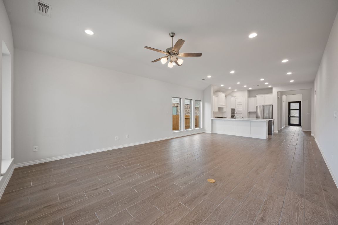 1037 Thunderhead Trail Georgetown, TX 78628 - Photo 10 of 33 a view of an empty room with a kitchen