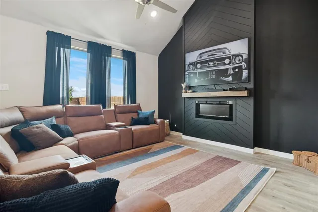 a bedroom with furniture and a wooden floor