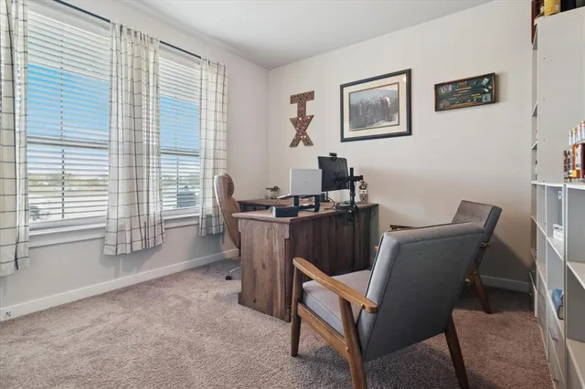 a work room with furniture and windows