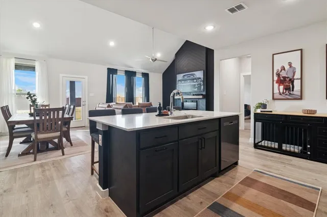 a kitchen with a sink and cabinets
