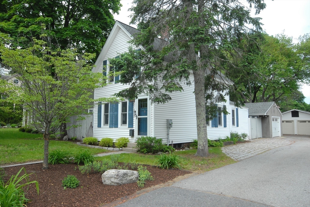 1832 Main Street Concord, MA 01742 - Photo 21 of 25 a front view of a house with garden