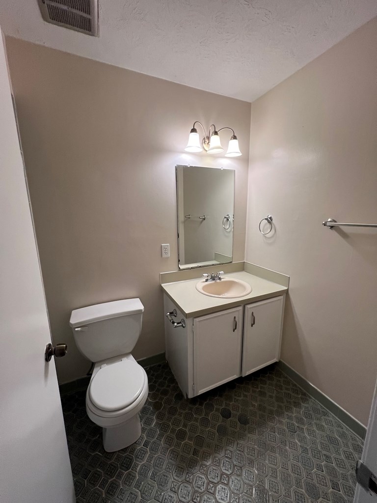 6323 Old Post Court Columbus, GA 31909 - Photo 7 of 13 a bathroom with a sink and mirror with toilet