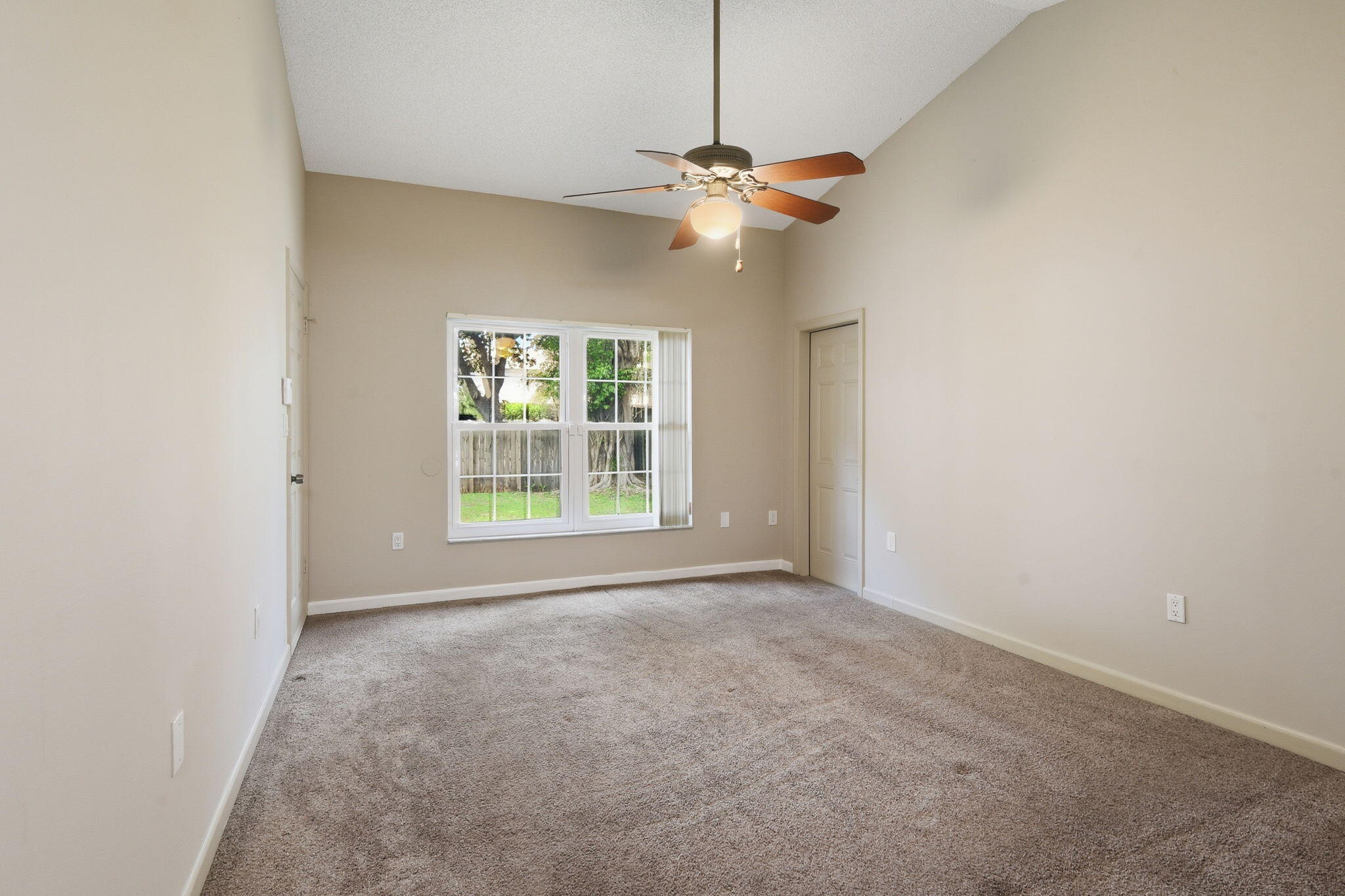 7350 Southwest 161st Place Miami, FL 33193 - Photo 14 of 31 an empty room with windows and fan