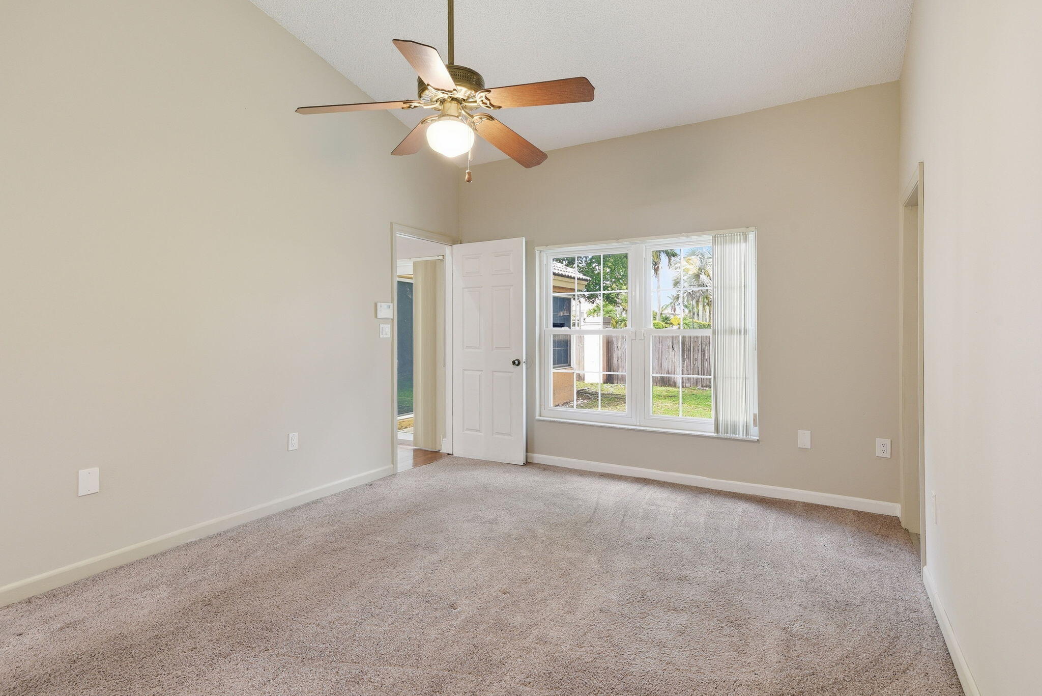 7350 Southwest 161st Place Miami, FL 33193 - Photo 15 of 31 an empty room with windows and fan
