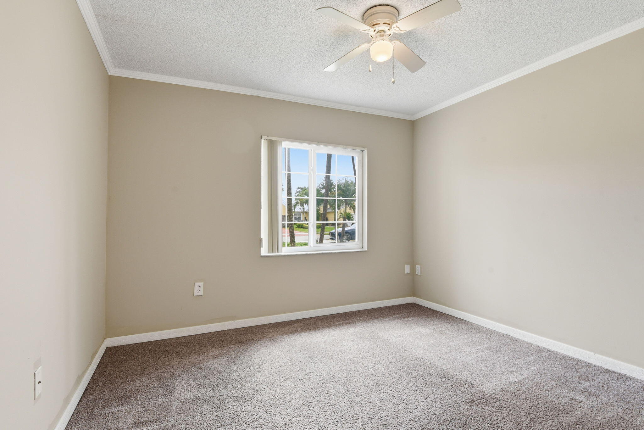 7350 Southwest 161st Place Miami, FL 33193 - Photo 18 of 31 an empty room with a window and a fan