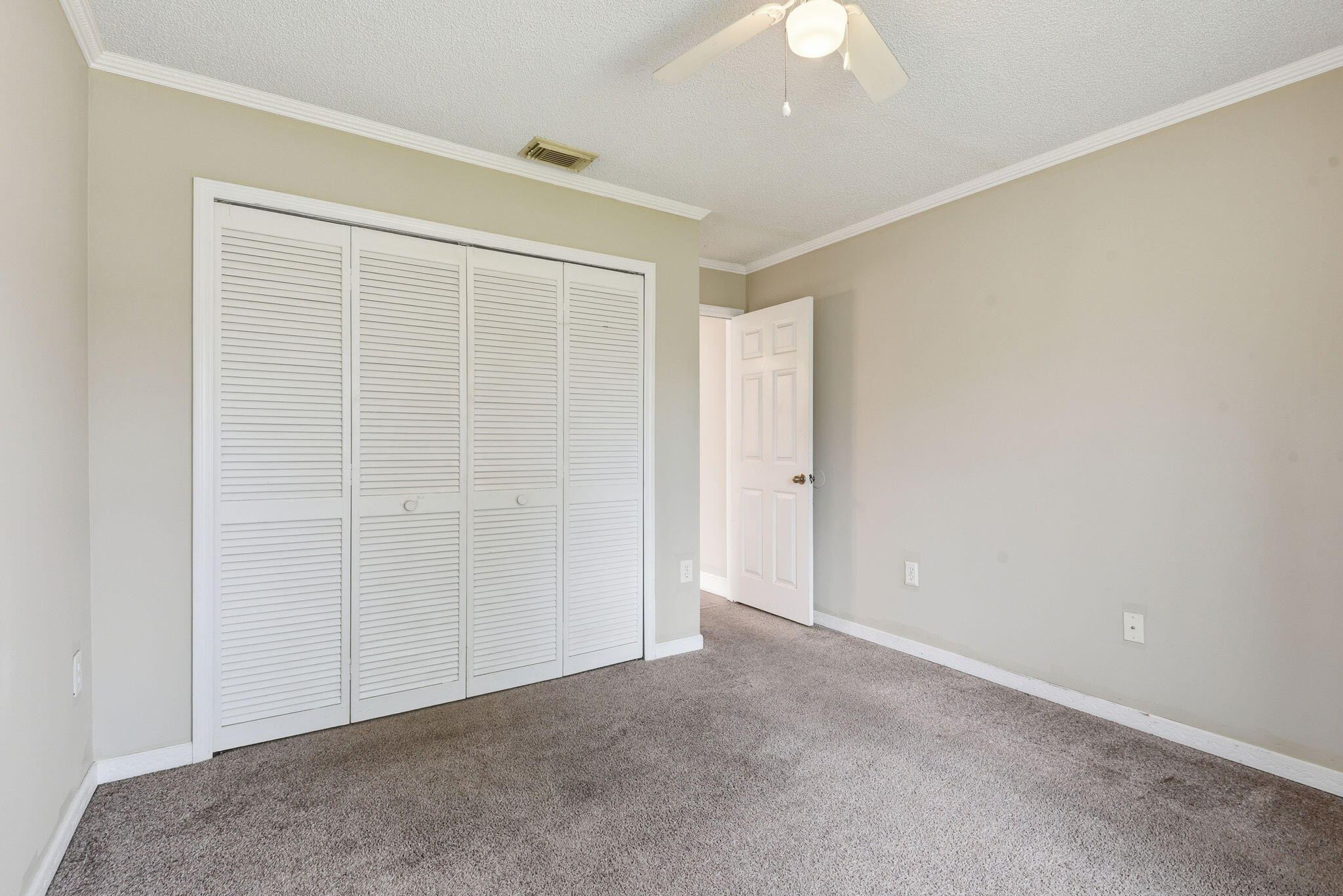 7350 Southwest 161st Place Miami, FL 33193 - Photo 19 of 31 an empty room with a ceiling fan and a window