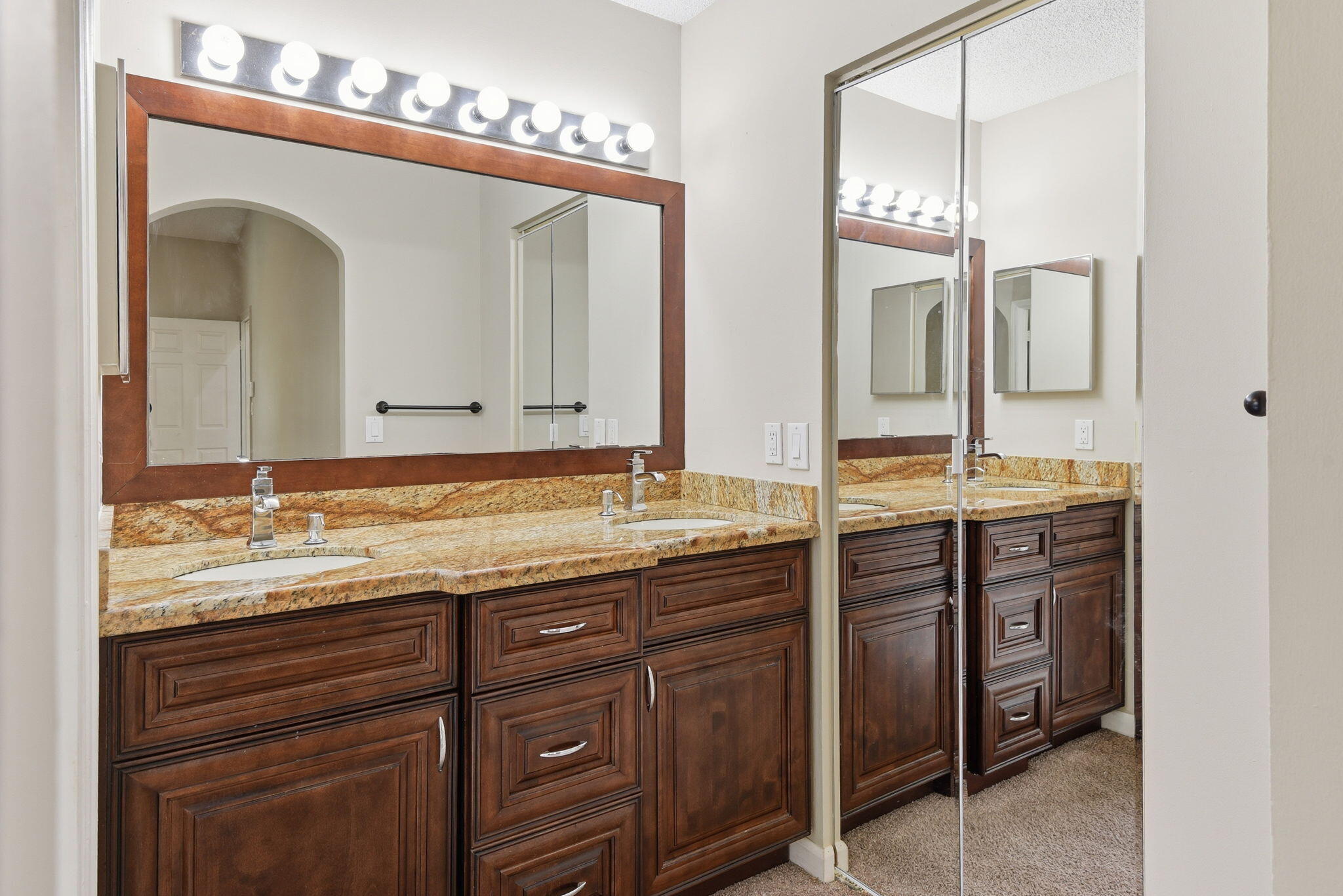 7350 Southwest 161st Place Miami, FL 33193 - Photo 21 of 31 a bathroom with a granite countertop double vanity sink and a mirror