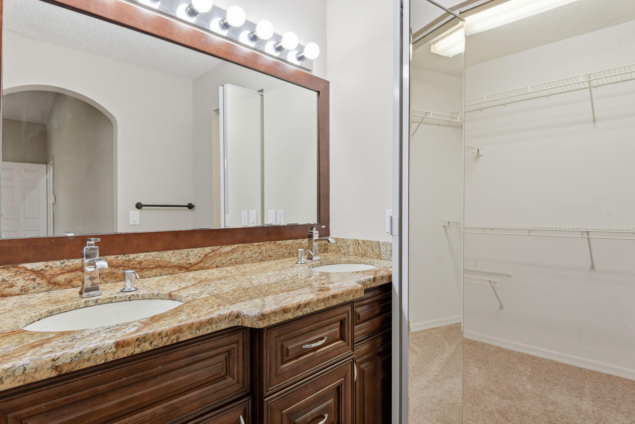 7350 Southwest 161st Place Miami, FL 33193 - Photo 23 of 31 a bathroom with a granite countertop sink and a mirror