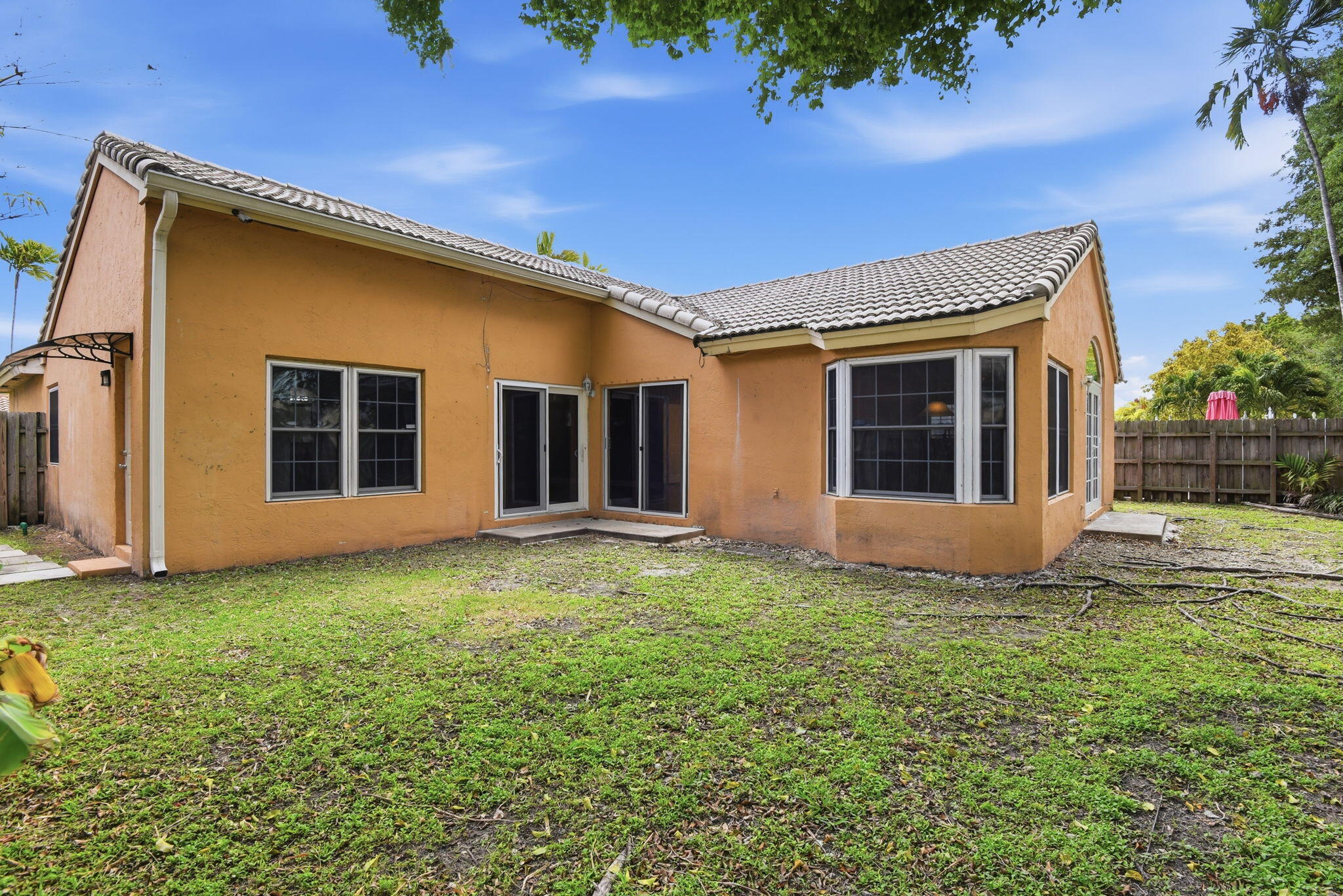 7350 Southwest 161st Place Miami, FL 33193 - Photo 30 of 31 a view of a house with backyard