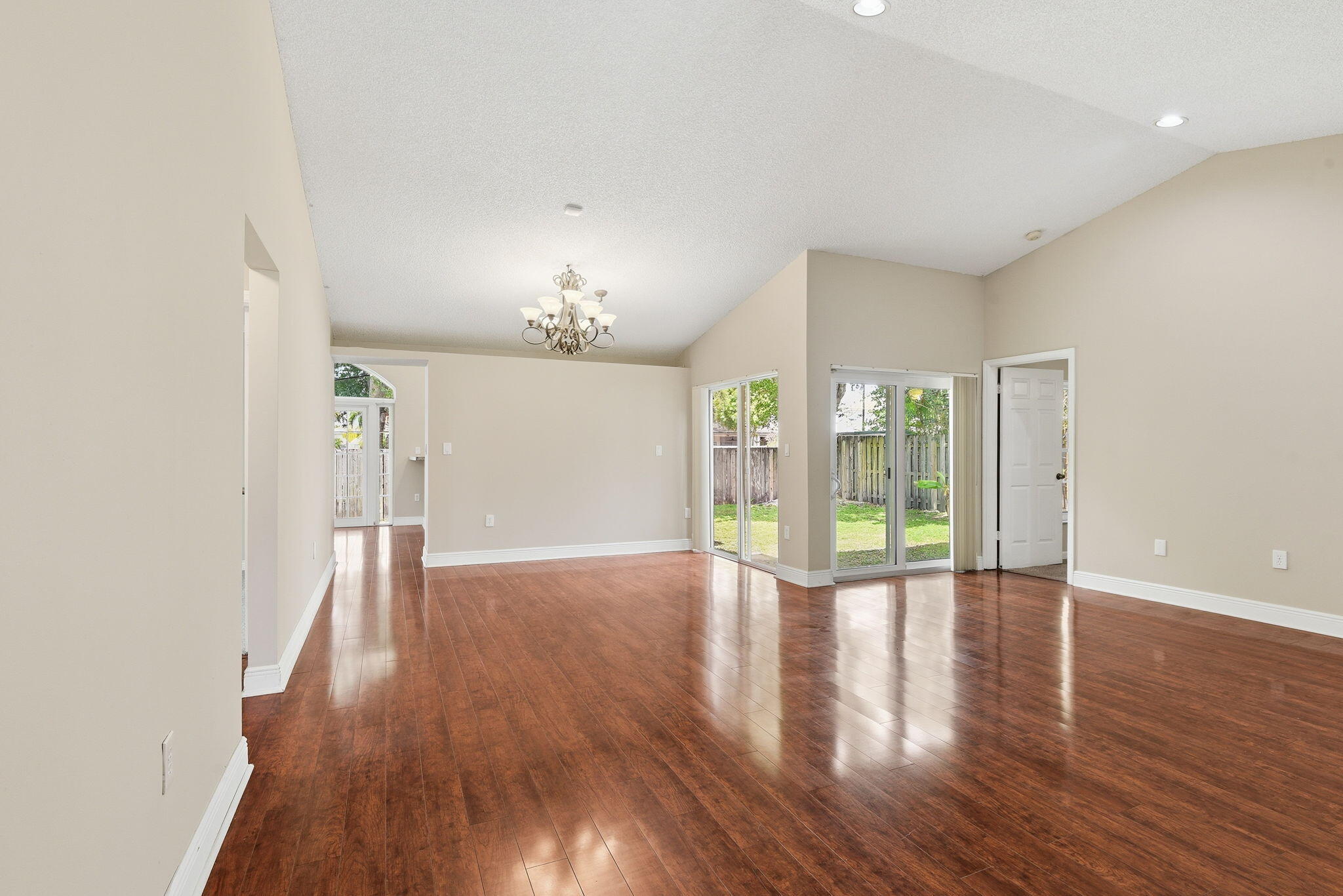 7350 Southwest 161st Place Miami, FL 33193 - Photo 4 of 31 a view of an empty room with wooden floor and a window