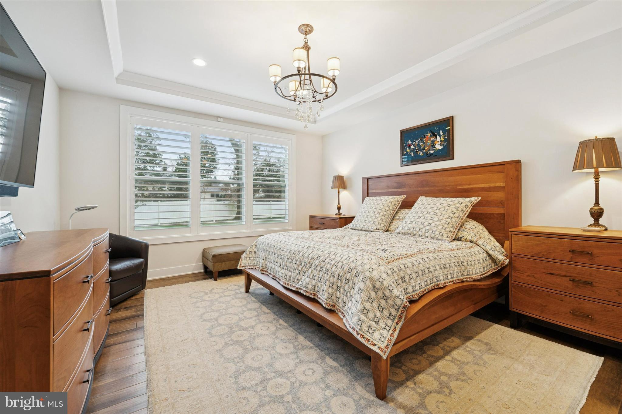 658 Levering Street Blue Bell, PA 19422 - Photo 16 of 38 a bedroom with a bed and a chandelier