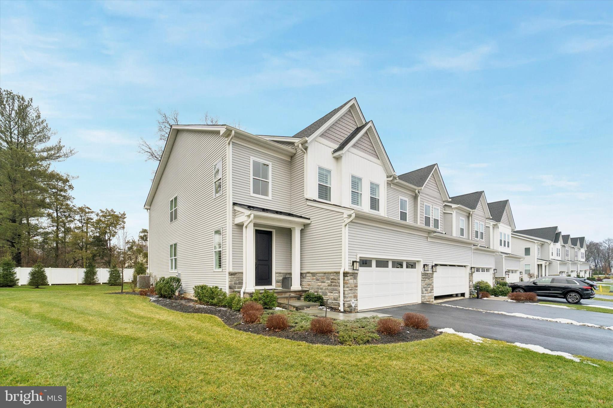 658 Levering Street Blue Bell, PA 19422 - Photo 2 of 38 a front view of a house with a yard and garage