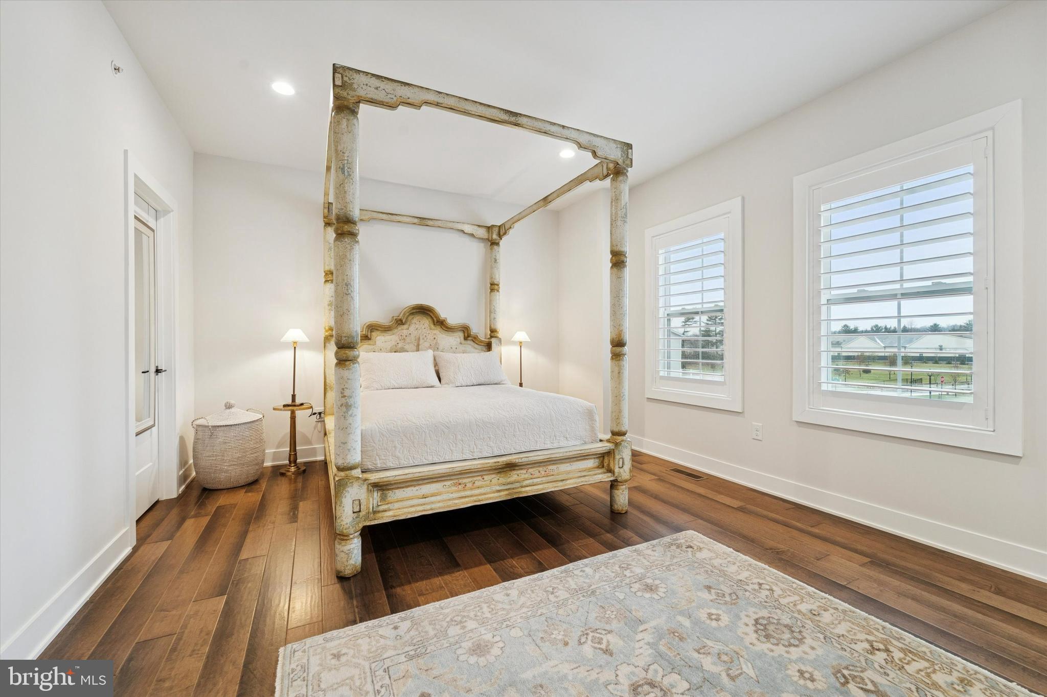 658 Levering Street Blue Bell, PA 19422 - Photo 25 of 38 a bedroom with a bed and a window with wooden floor