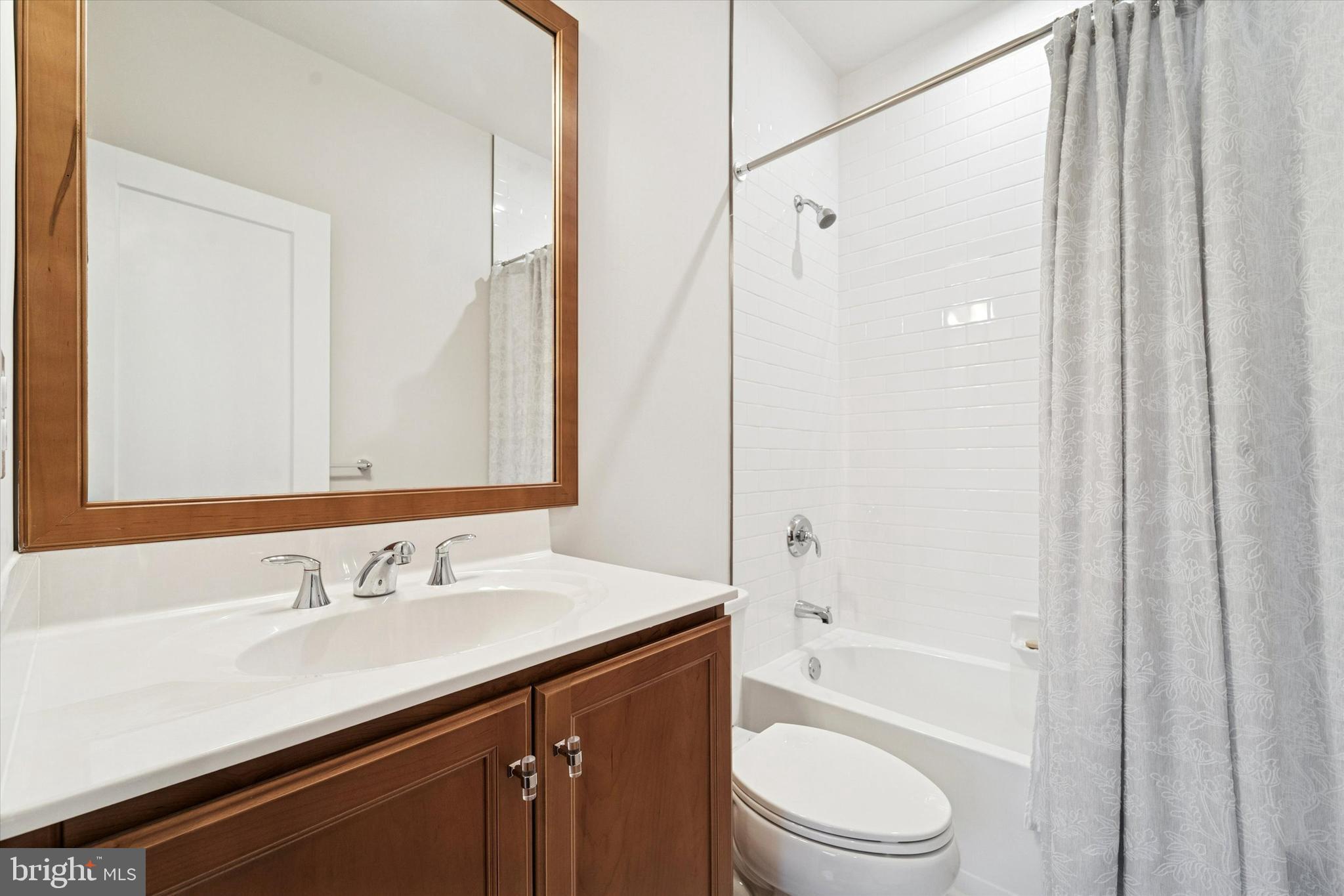 658 Levering Street Blue Bell, PA 19422 - Photo 26 of 38 a bathroom with a sink a toilet and a bathtub