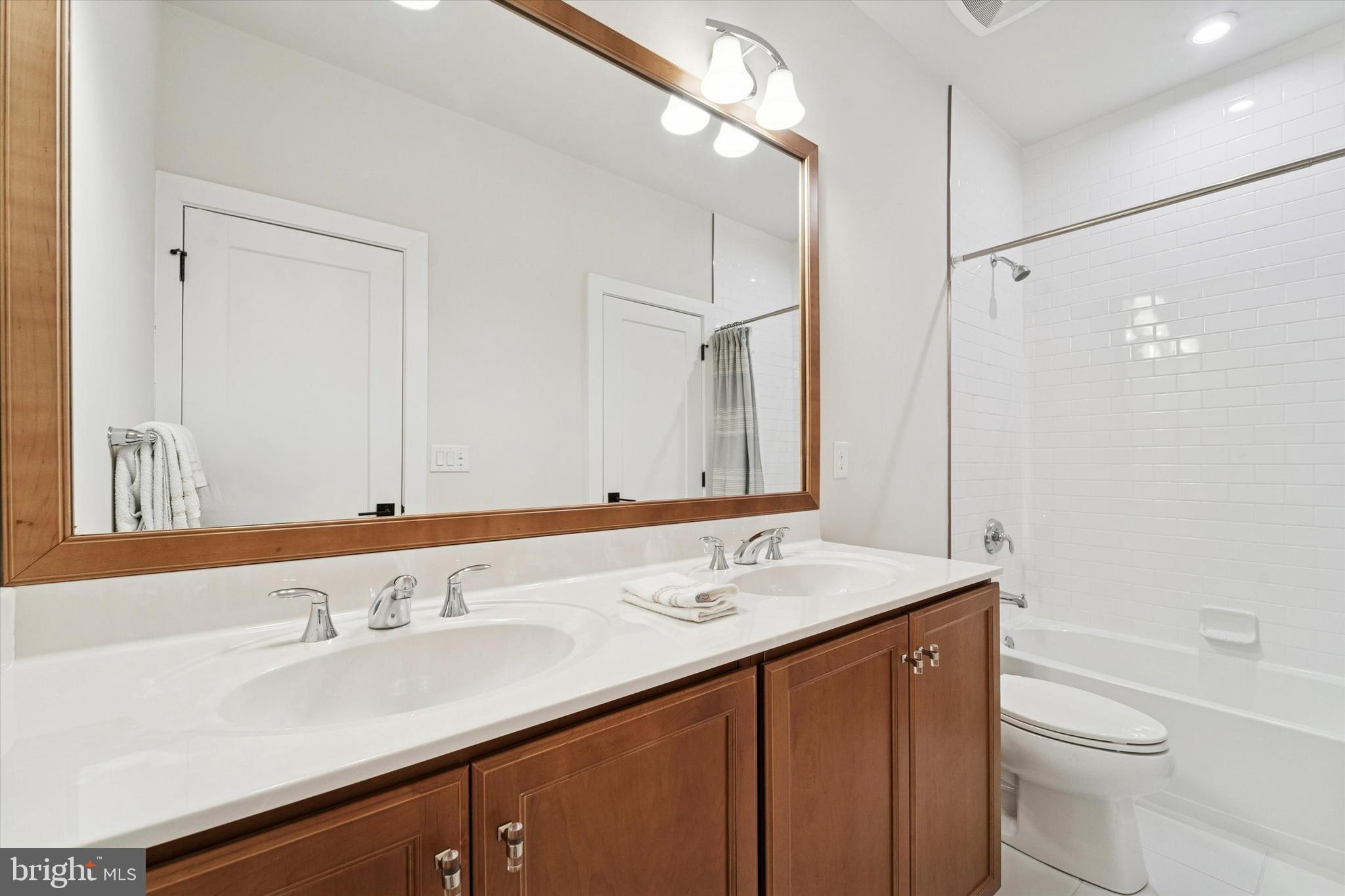658 Levering Street Blue Bell, PA 19422 - Photo 27 of 38 a bathroom with a sink and a mirror