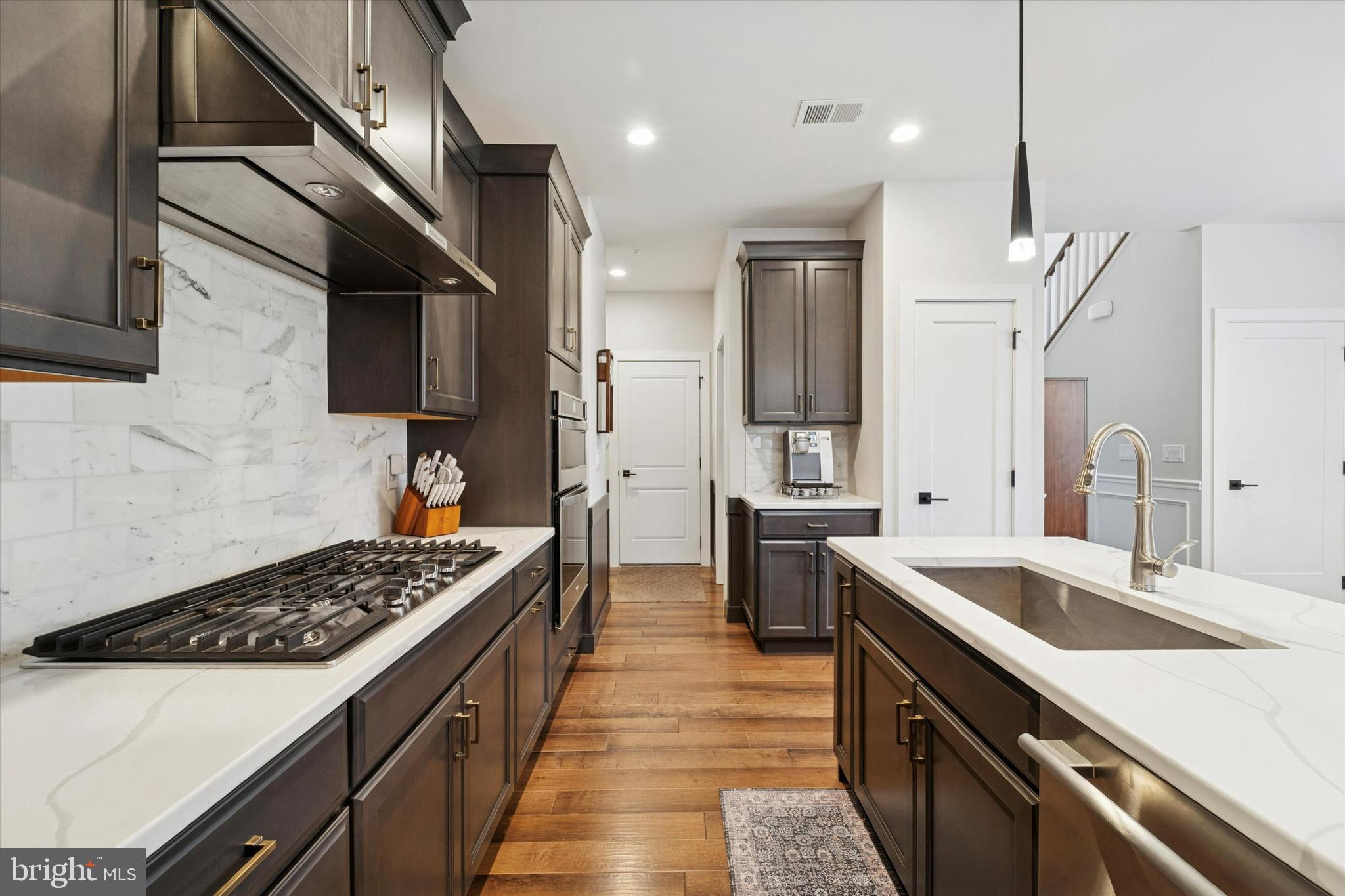 658 Levering Street Blue Bell, PA 19422 - Photo 10 of 38 a kitchen with stainless steel appliances kitchen island a sink stove and refrigerator
