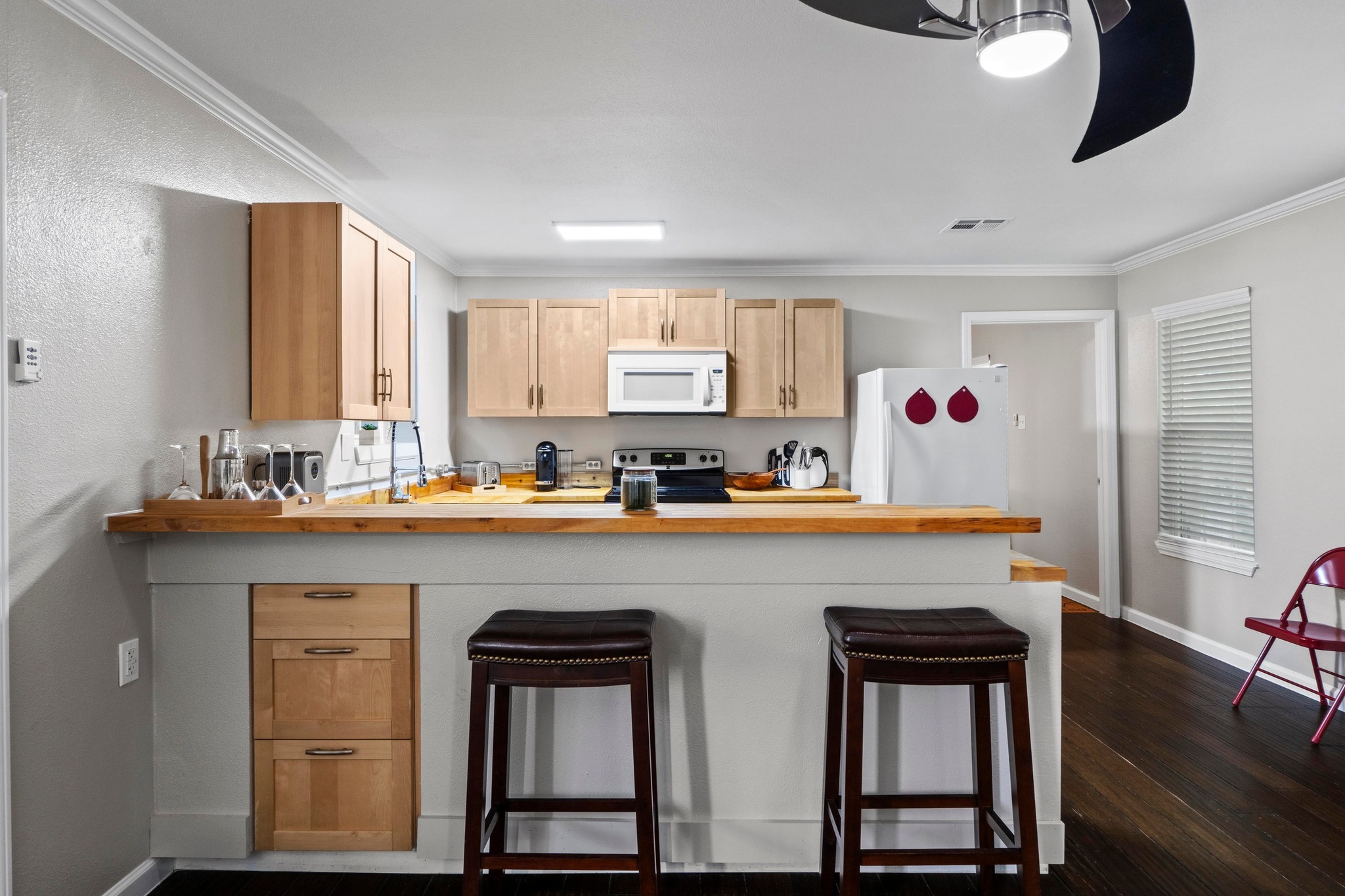 4512 Speedway, Unit A Austin, TX 78751 - Photo 14 of 39 a kitchen with a sink cabinets and wooden floor