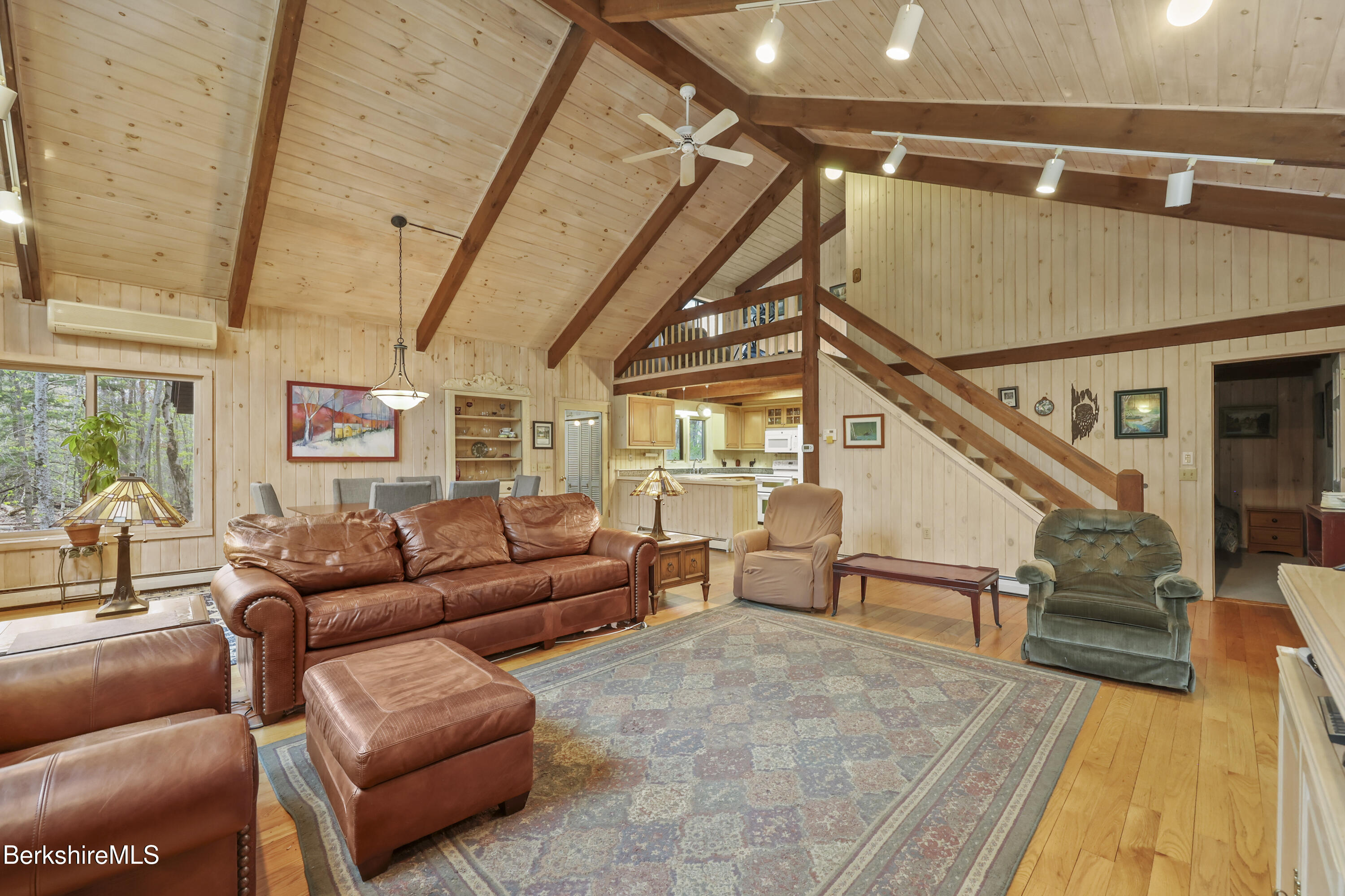 422 Bonny Rigg Hill Road Becket, MA 01223 - Photo 4 of 60 a living room with furniture a wooden floor and next to a window