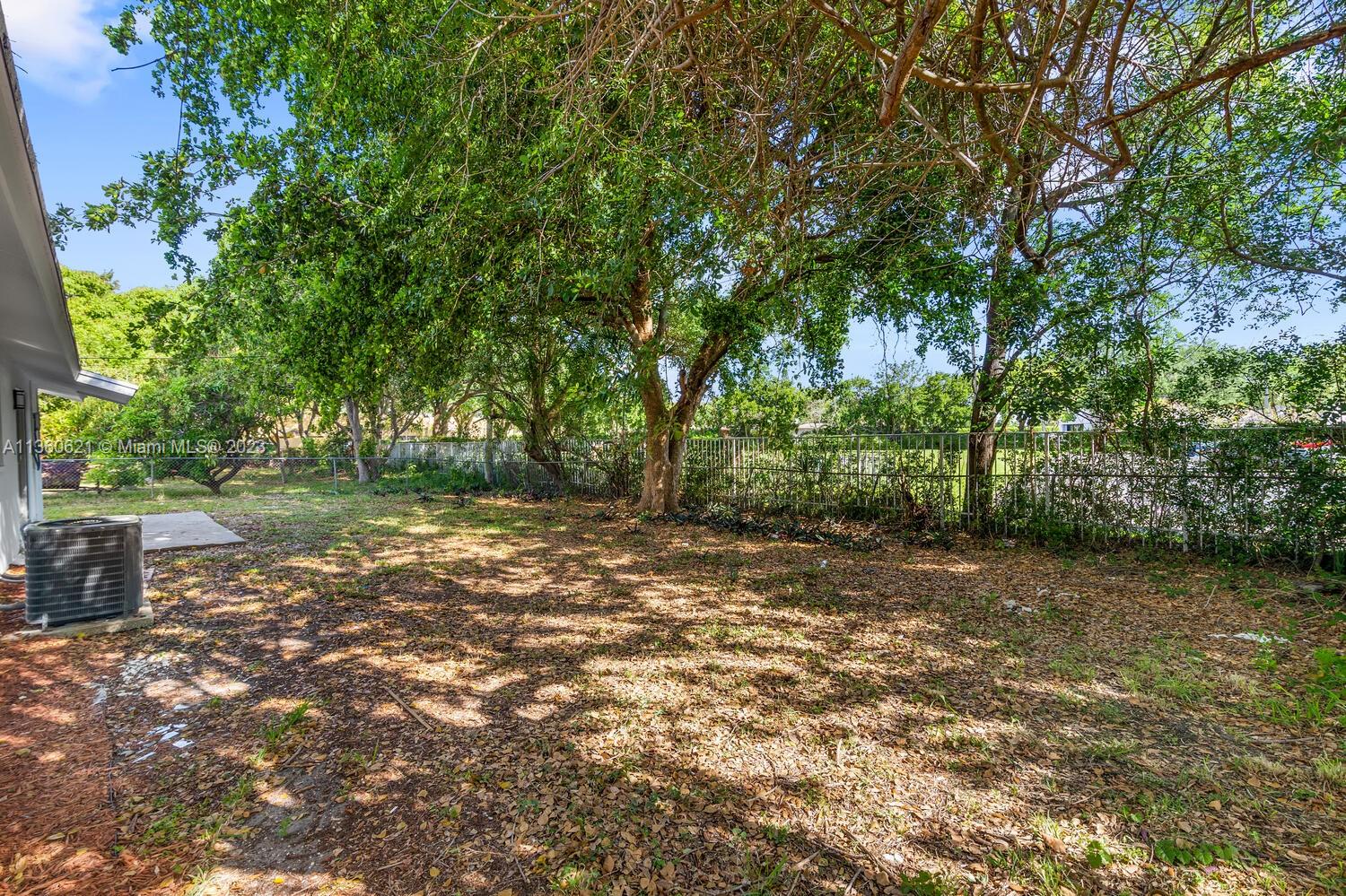 611 Davis Road Delray Beach, FL 33445 - Photo 20 of 22 a view of a yard with a tree