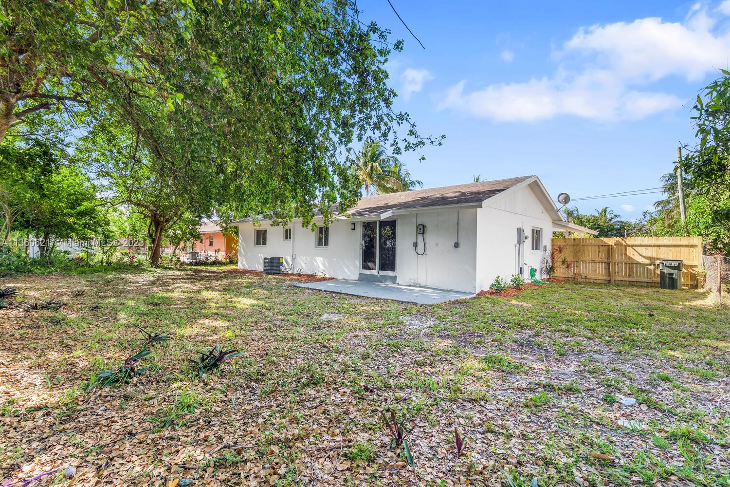 611 Davis Road Delray Beach, FL 33445 - Photo 21 of 22 a view of a house with backyard and trees