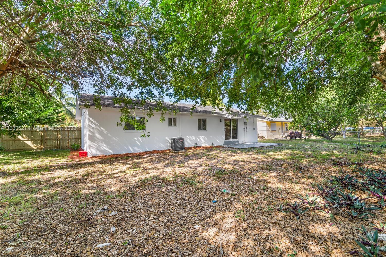 611 Davis Road Delray Beach, FL 33445 - Photo 22 of 22 a view of a house with yard and a tree