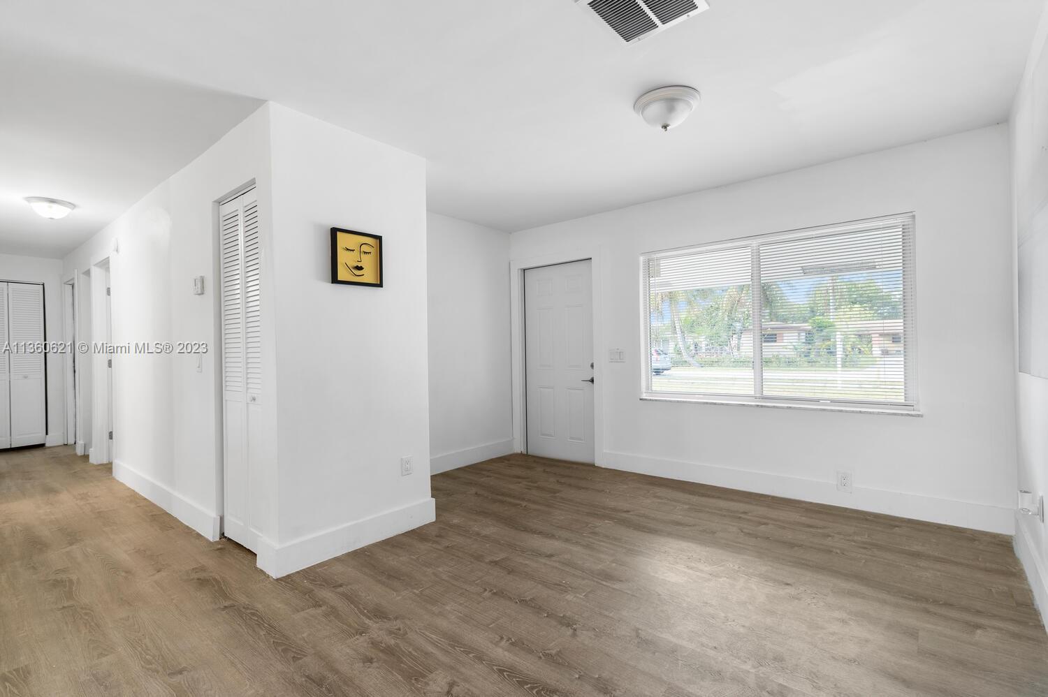 611 Davis Road Delray Beach, FL 33445 - Photo 9 of 22 a view of an empty room with a window