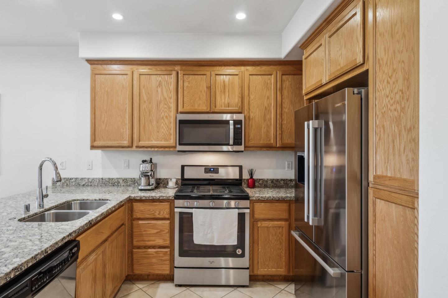 25478 Huntwood Avenue Hayward, CA 94544 - Photo 13 of 35 a kitchen with stainless steel appliances granite countertop a refrigerator stove and sink