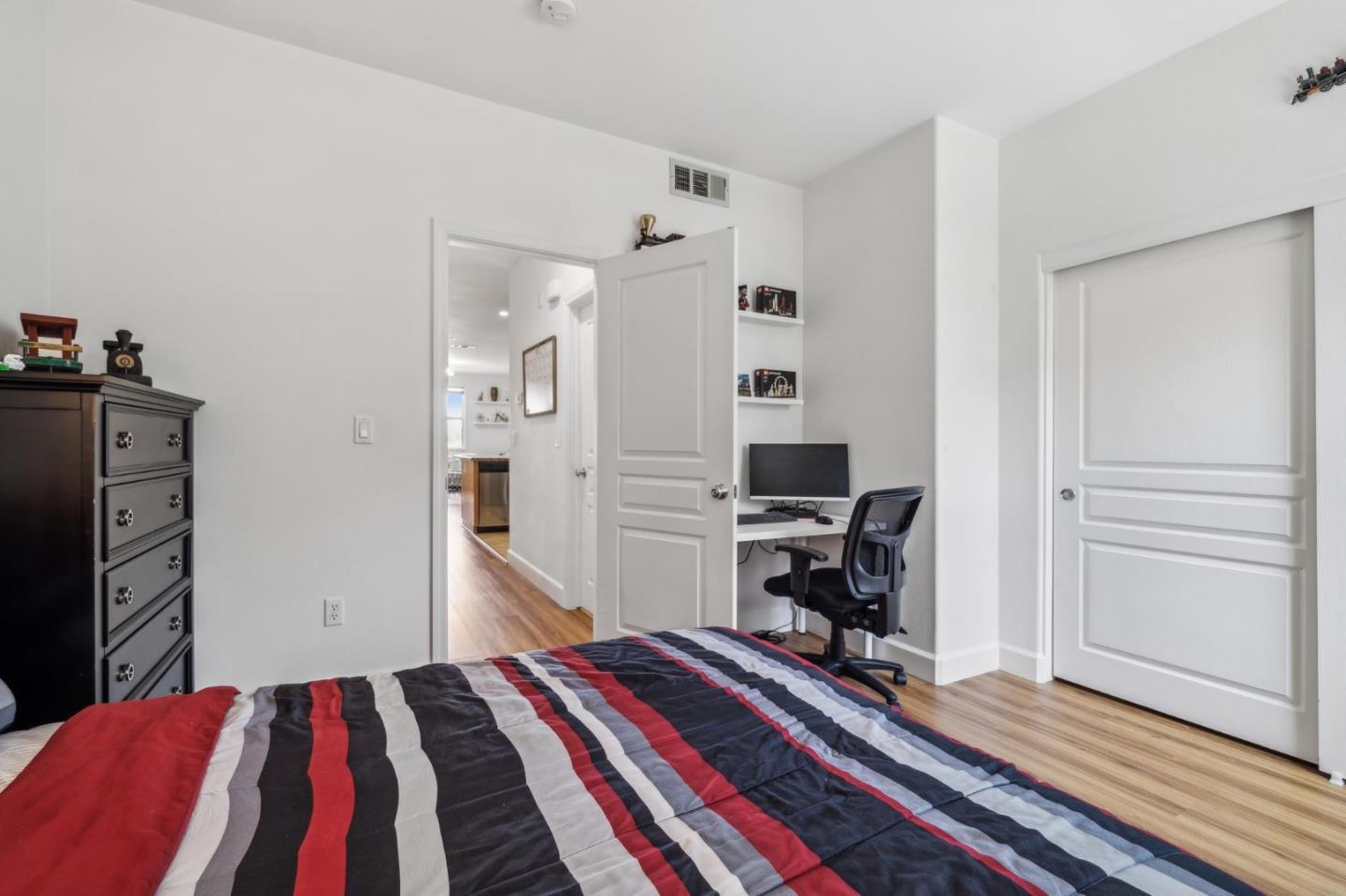 25478 Huntwood Avenue Hayward, CA 94544 - Photo 18 of 35 a bedroom with a bed and a workspace