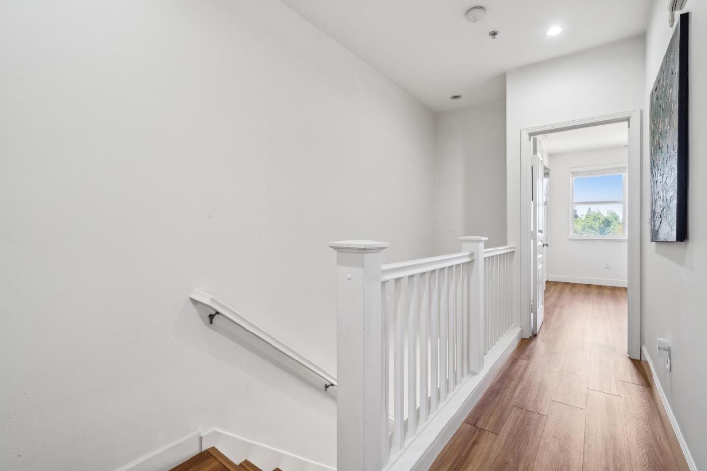 25478 Huntwood Avenue Hayward, CA 94544 - Photo 21 of 35 a view of a hallway with wooden floor