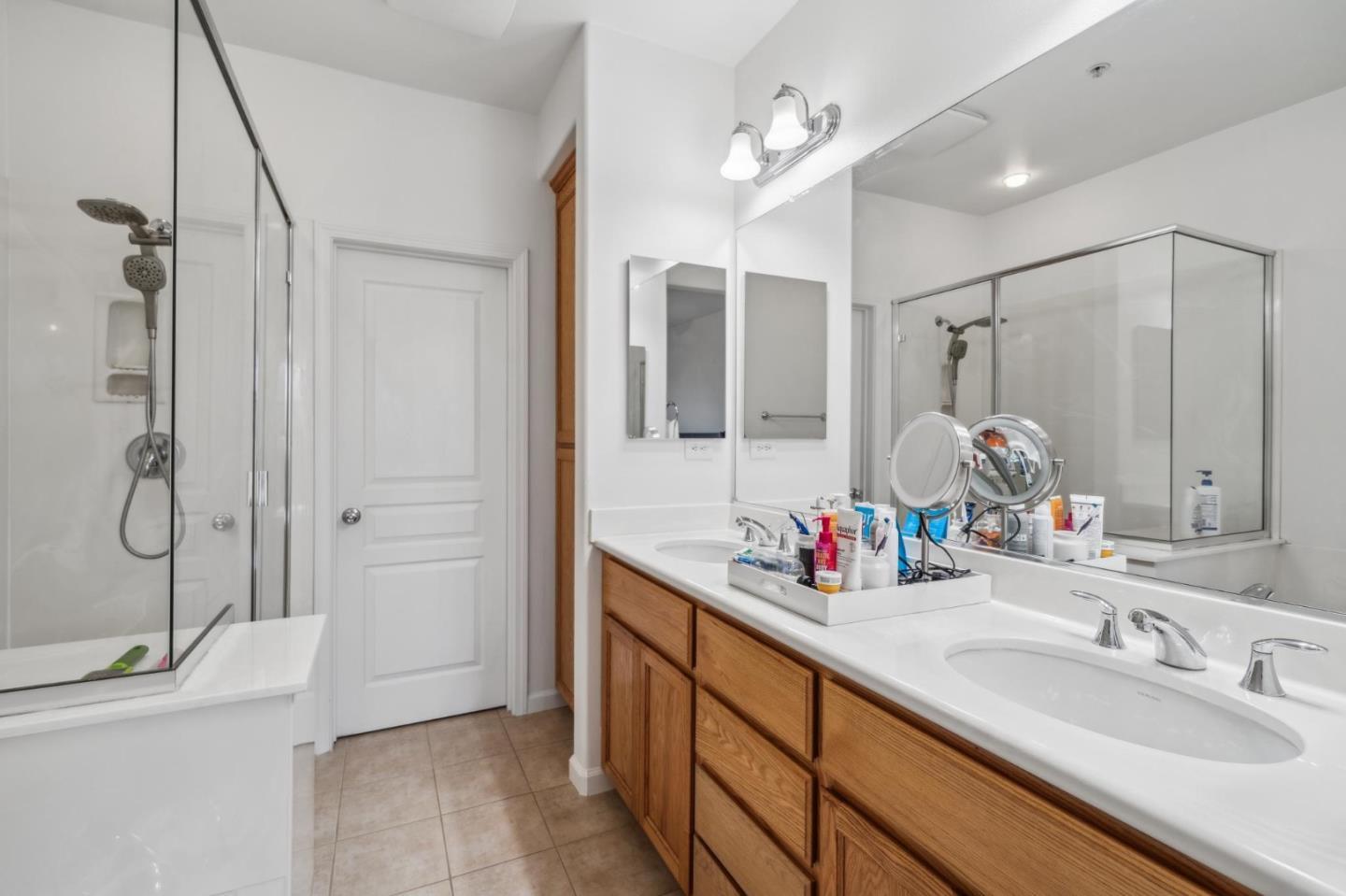25478 Huntwood Avenue Hayward, CA 94544 - Photo 25 of 35 a bathroom with a double vanity sink mirror and shower