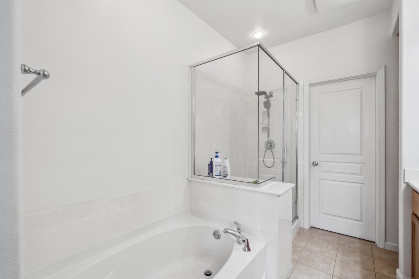 25478 Huntwood Avenue Hayward, CA 94544 - Photo 26 of 35 a bathroom with a bathtub and a shower